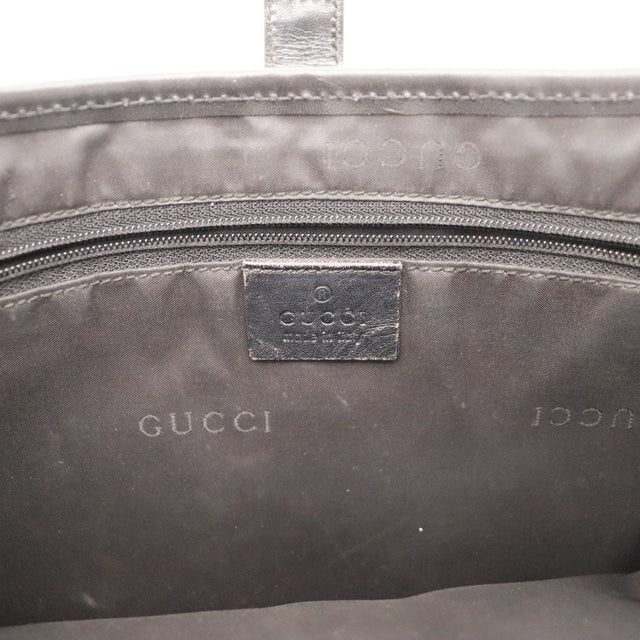 Détail coin inférieur gauche Gucci New Jackie cuir noir — AMANA Vintage