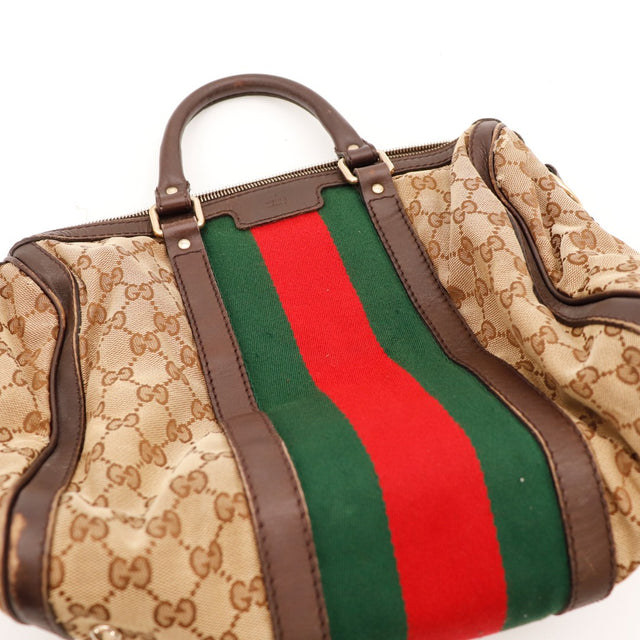 Détail défaut coin inférieur cuir usé Gucci Joy Boston Web — AMANA Vintage