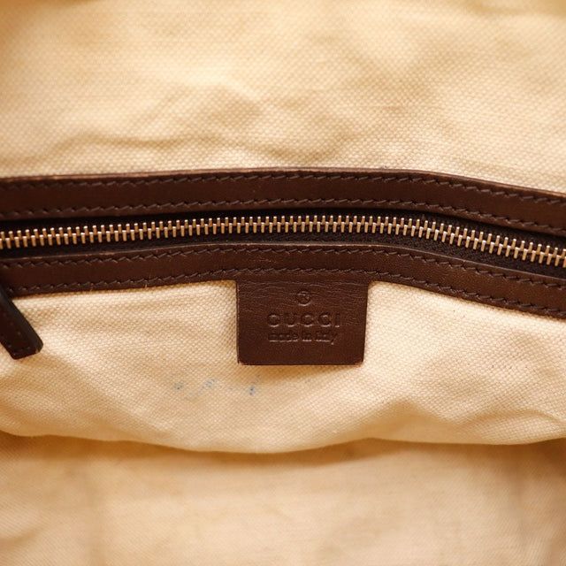 Détail coin inférieur frottements cuir marron Gucci Joy Boston Web — AMANA Vintage