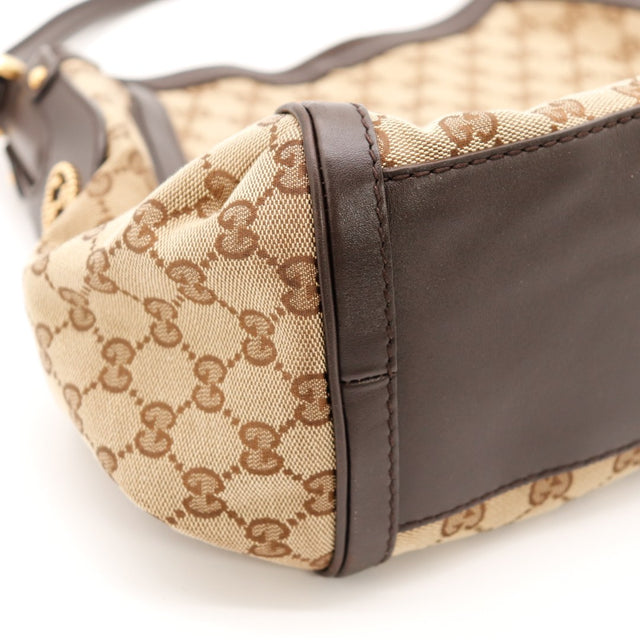 Détail coin inférieur gauche Hobo Gucci cuir marron occasion — AMANA Vintage