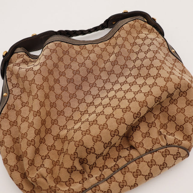 Détail anse tressée et fermoir horsebit doré Gucci Hobo occasion — AMANA Vintage