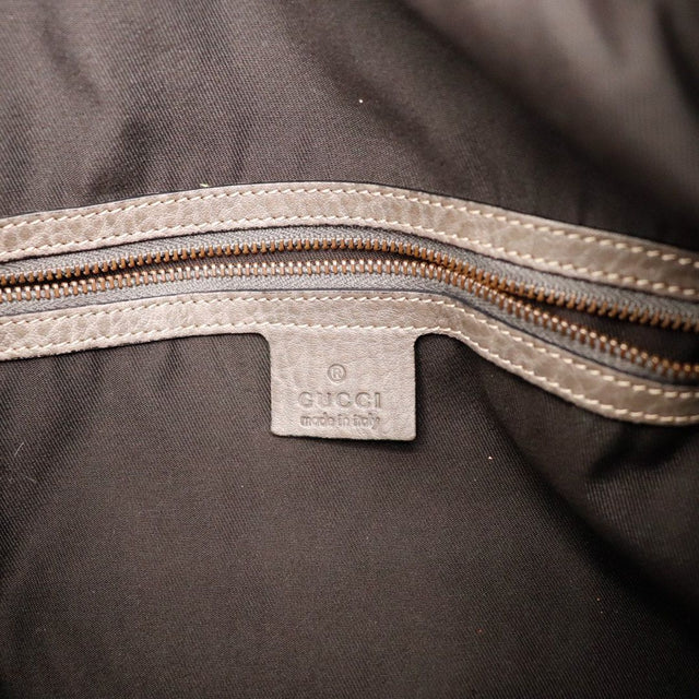 Détail canvas Gucci monogrammé froissé état de la toile — AMANA Vintage
