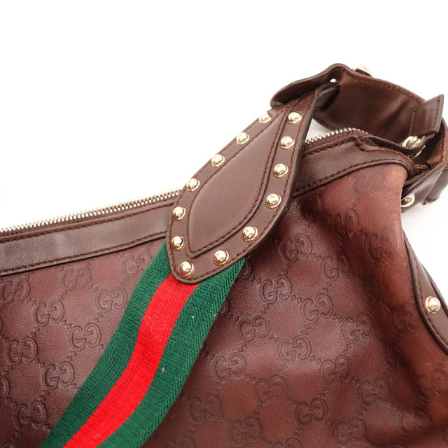 Détail anse et rivets Gucci Indy cuir marron occasion — AMANA Vintage
