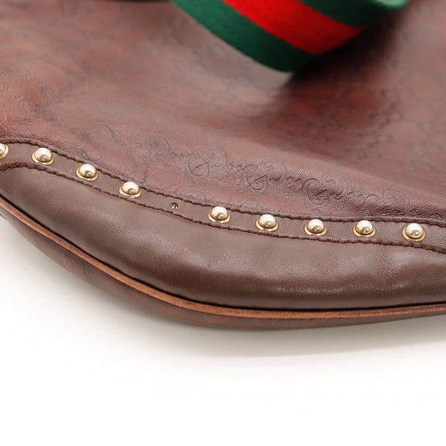 Détail coins inférieurs Gucci Indy frottements cuir marron — AMANA Vintage