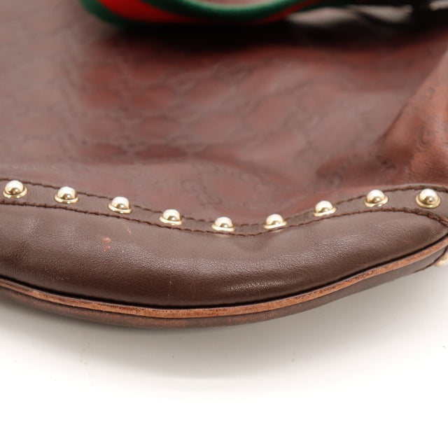 Détail coins inférieurs côté Gucci Indy usure cuir — AMANA Vintage