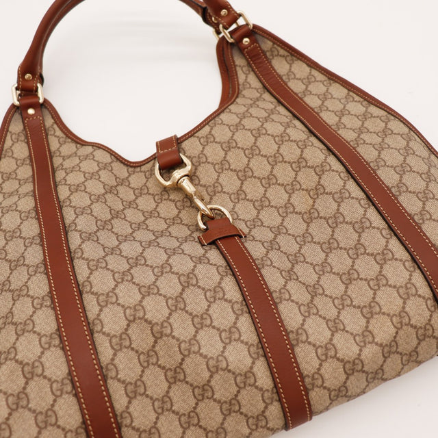 Détail fermoir Horsebit doré Gucci toile monogrammée — AMANA Vintage