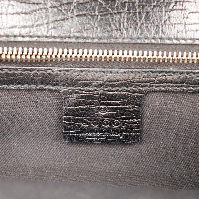 Détail étiquette cuir intérieure Gucci craquelures doublure grise — AMANA Vintage