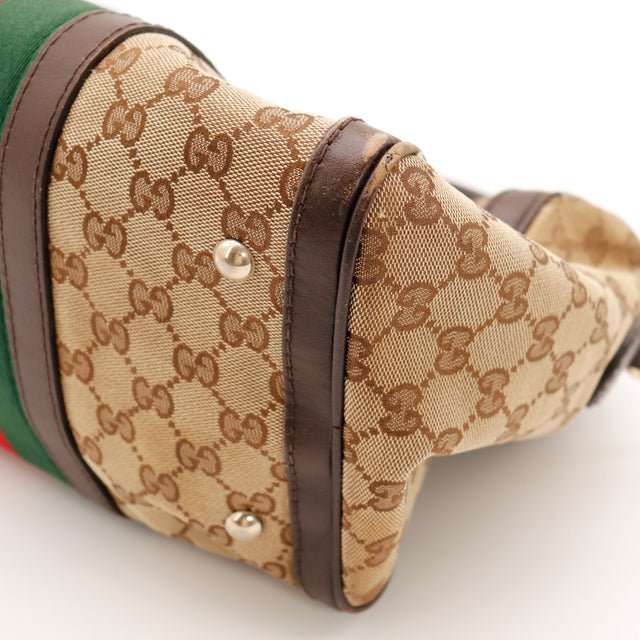 Détail anse Gucci Boston Web cuir usé assombri — AMANA Vintage