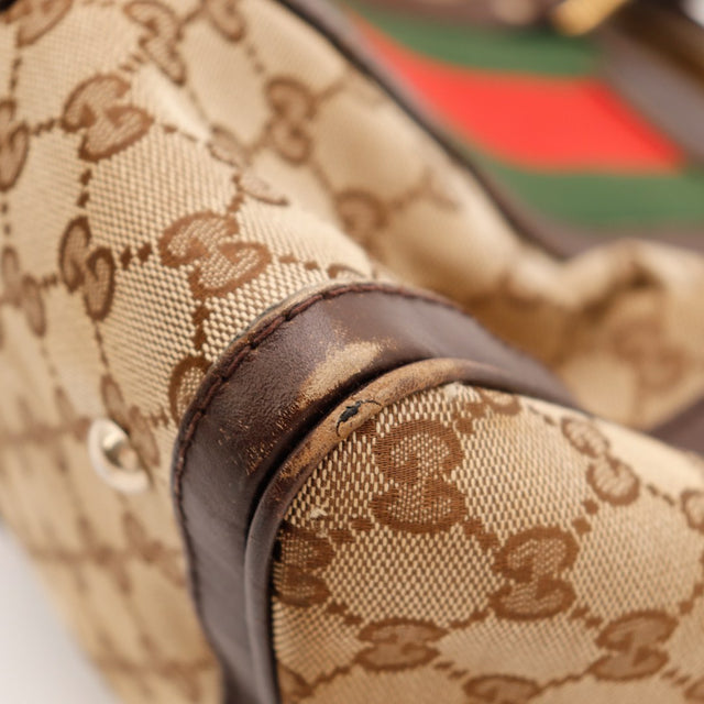 Détail déchirure doublure intérieure Gucci Boston Web — AMANA Vintage