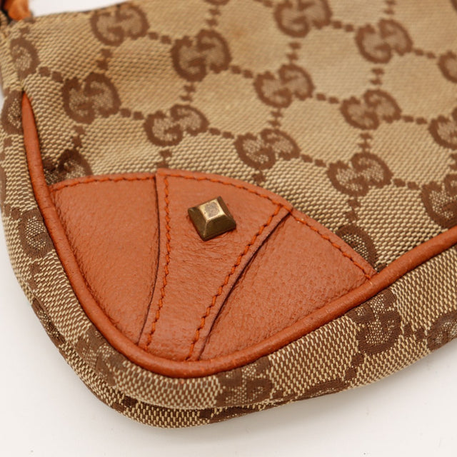 Détail coin cuir terracotta Gucci Hobo Chain usure légère — AMANA Vintage