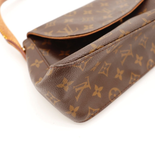 Vue de profil Louis Vuitton Mini Looping Toile Monogramme occasion authentique — AMANA Vintage