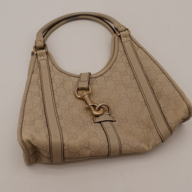 Détail des coins inférieurs Gucci Hobo cuir Guccissima beige occasion authentique — AMANA Vintage