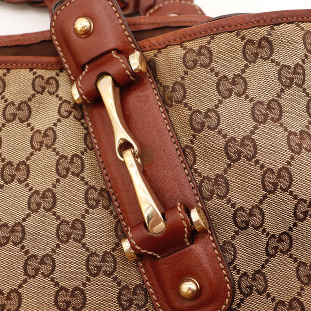Détail des coutures Gucci Hobo Pelham cuir marron occasion authentique — AMANA Vintage