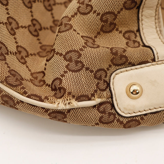 Détail du mors doré Gucci Hobo Horsebit toile monogrammée occasion authentique — AMANA Vintage
