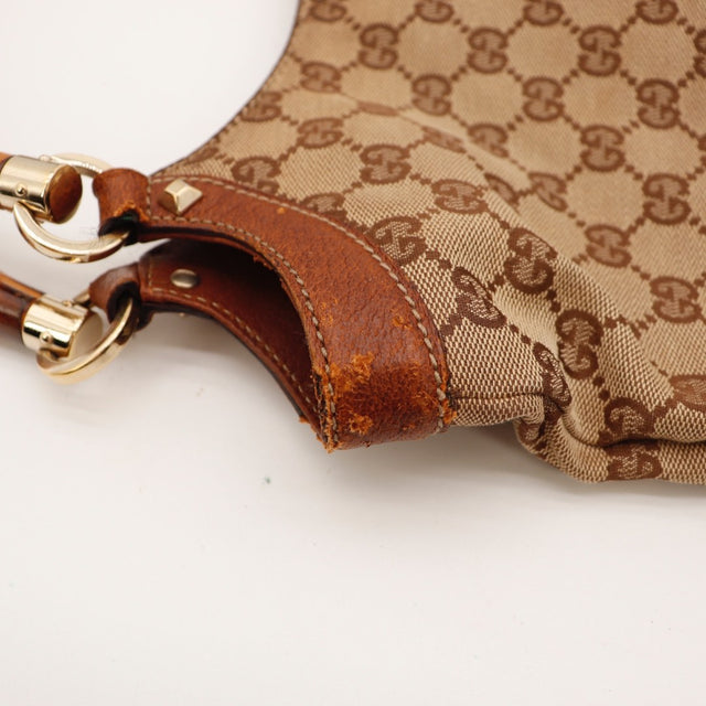 Détail de l'attache en cuir Gucci Bambou marron occasion authentique — AMANA Vintage