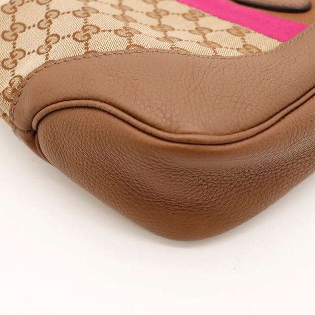 Vue de profil Gucci New Jackie toile monogrammée beige et ébène occasion authentique — AMANA Vintage