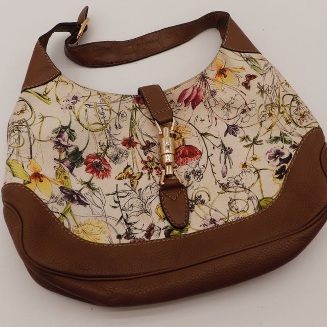 Vue de profil du sac Gucci Jackie toile Flora occasion authentique — AMANA Vintage