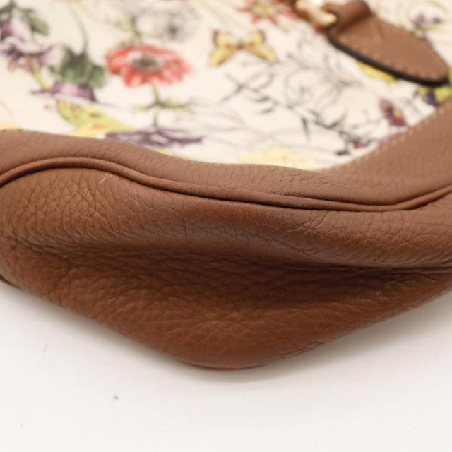 Détail de la boucle de réglage dorée Gucci Jackie toile Flora — AMANA Vintage