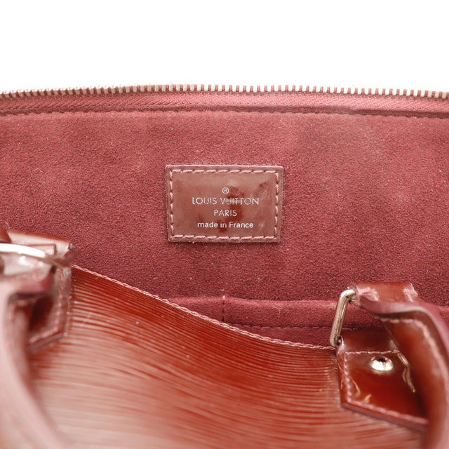Détail de l'argenterie Louis Vuitton Alma PM cuir Épi bordeaux occasion authentique — AMANA Vintage