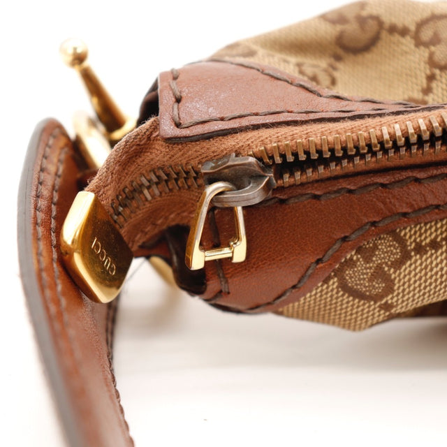 Vue de trois quarts Gucci Hobo toile monogrammée beige occasion authentique — AMANA Vintage