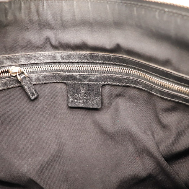 Intérieur doublure textile noire et étiquette Gucci Hobo occasion authentique — AMANA Vintage
