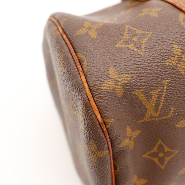 Détail coin et lisere cuir Louis Vuitton Papillon 30 — AMANA Vintage