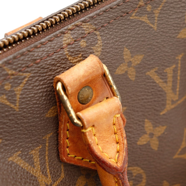 Detail attache anse cuir vachette Louis Vuitton Speedy 25 — AMANA Vintage