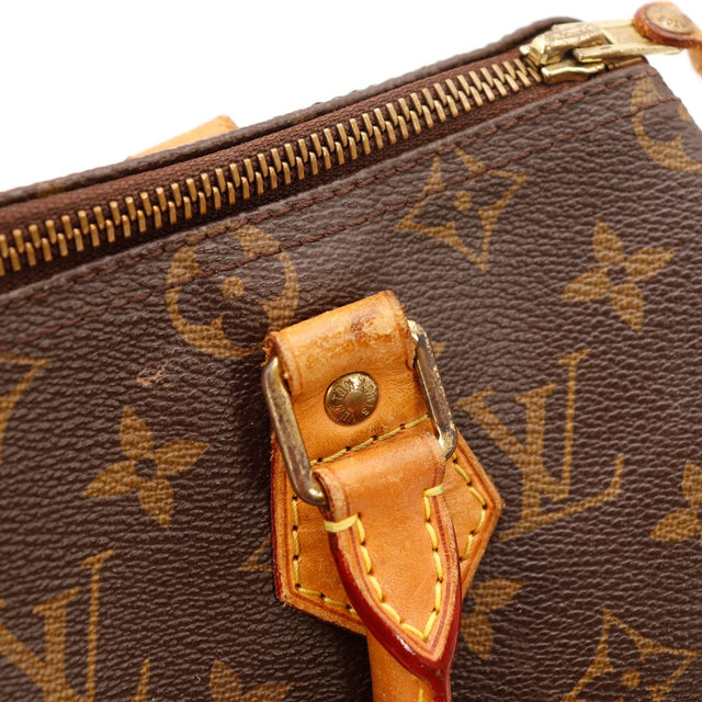 Detail attache anse et pastille cuir Louis Vuitton Speedy 25 occasion authentique — AMANA Vintage