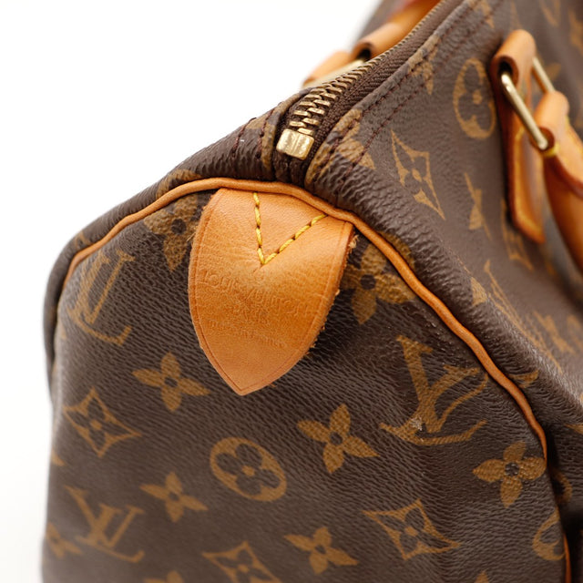 Detail tab vachette Louis Vuitton Speedy 30 patine caramel occasion — AMANA Vintage
