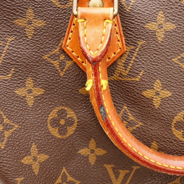 Detail anse Louis Vuitton Speedy 30 tache noire patine caramel occasion — AMANA Vintage