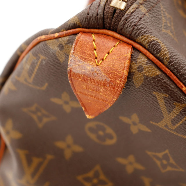 Detail anse Louis Vuitton Speedy 30 cuir vachette patine caramel — AMANA Vintage