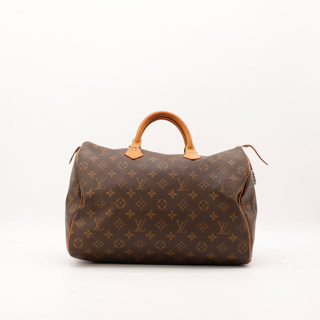 Profil droit Louis Vuitton Speedy 35 languette cuir et cadenas — AMANA Vintage