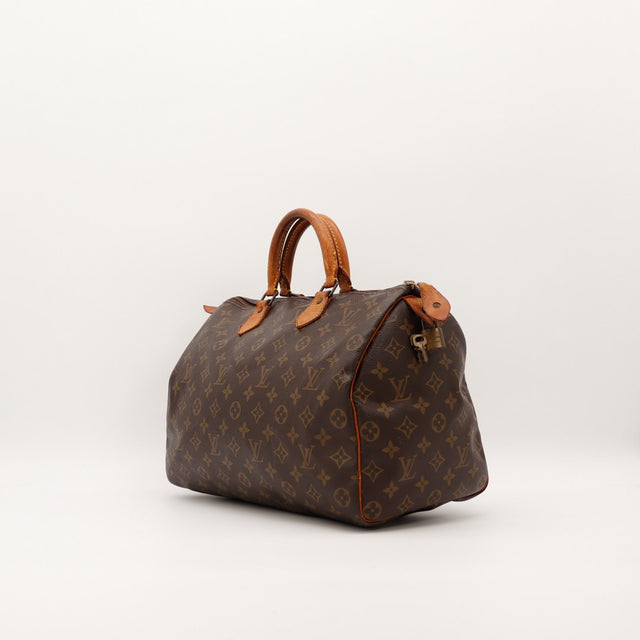 Louis Vuitton Speedy 30 vue de trois quarts droite toile monogrammée patine caramel — AMANA Vintage