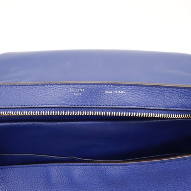 Vue de l'argenterie dorée Céline Trapèze bleu indigo occasion authentique — AMANA Vintage