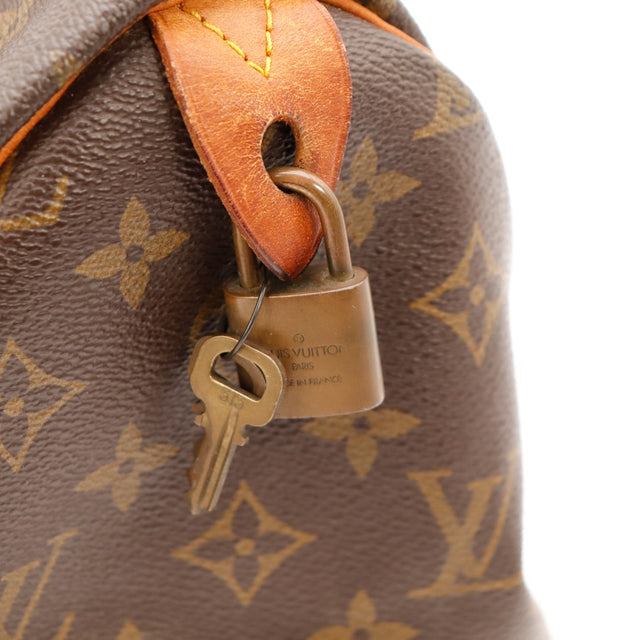 Détail cadenas et clé Louis Vuitton Speedy 30 occasion authentique — AMANA Vintage