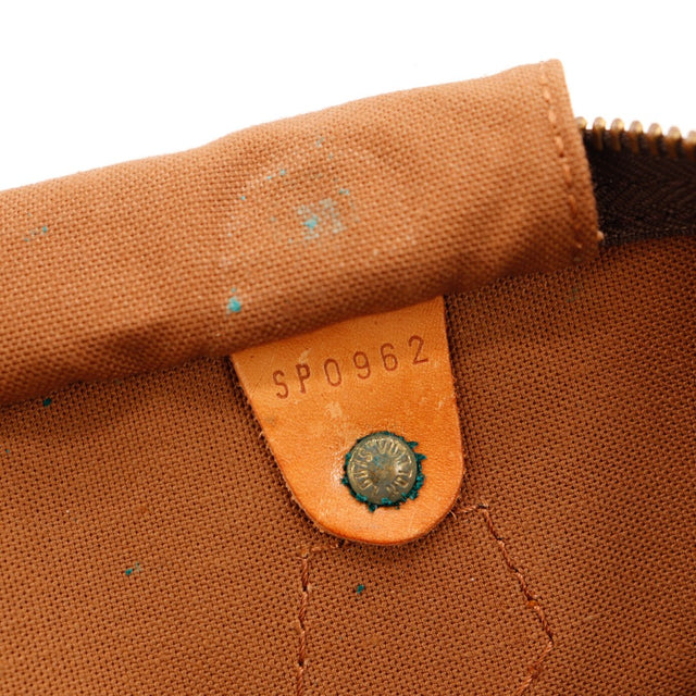 Détail anses vachette caramel et attaches Louis Vuitton Speedy 35 — AMANA Vintage