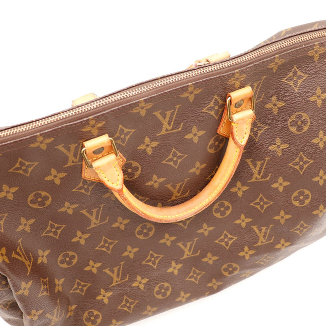 Détail languette cadenas vachette Louis Vuitton Speedy 35 — AMANA Vintage