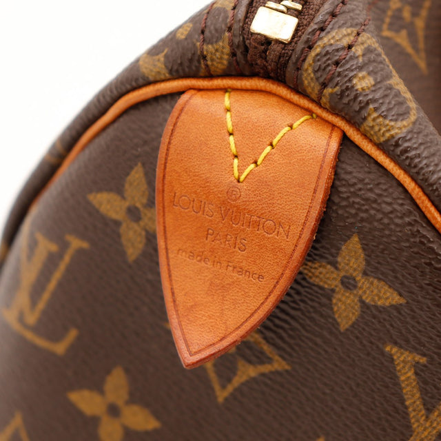 Détail tab cuir vachette Louis Vuitton Speedy 25 made in France — AMANA Vintage