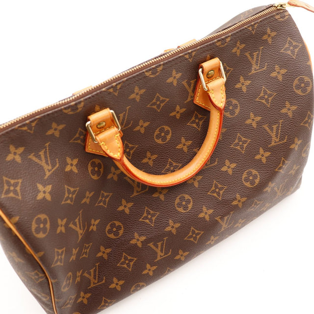 Vue anse cuir vachette patine caramel Louis Vuitton Speedy 35 — AMANA Vintage