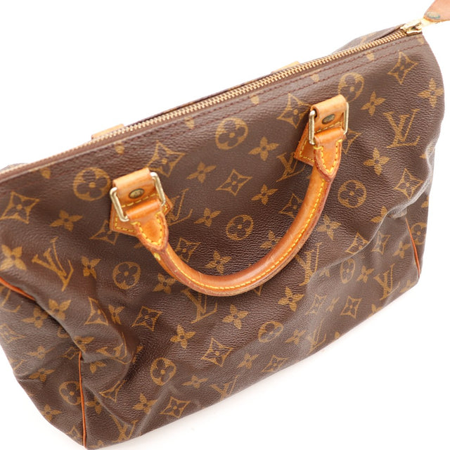 Détail anses Louis Vuitton Speedy 35 cuir vachette caramel occasion — AMANA Vintage