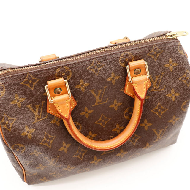 Détail anses et garnitures vachette Louis Vuitton Speedy 25 patine caramel — AMANA Vintage
