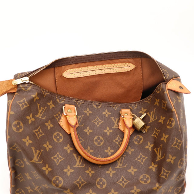 Détail de la tirette Louis Vuitton Speedy 30 Toile Monogramme occasion authentique — AMANA Vintage