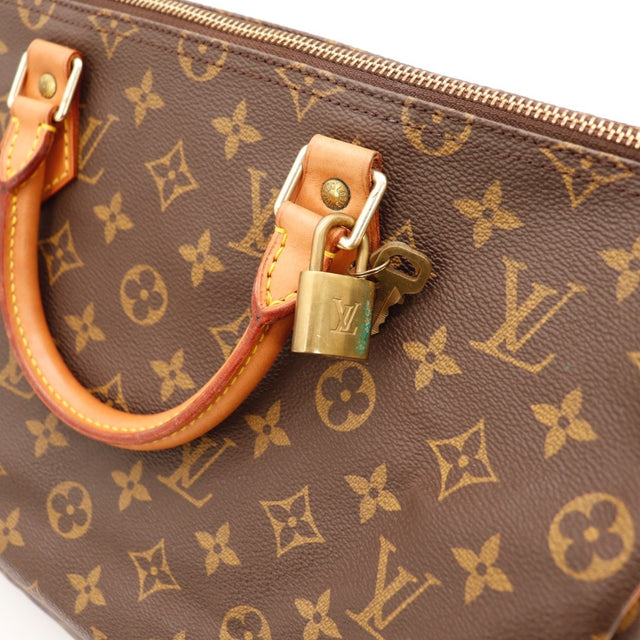 Détail des pattes Louis Vuitton Speedy 30 cuir vachette occasion authentique — AMANA Vintage