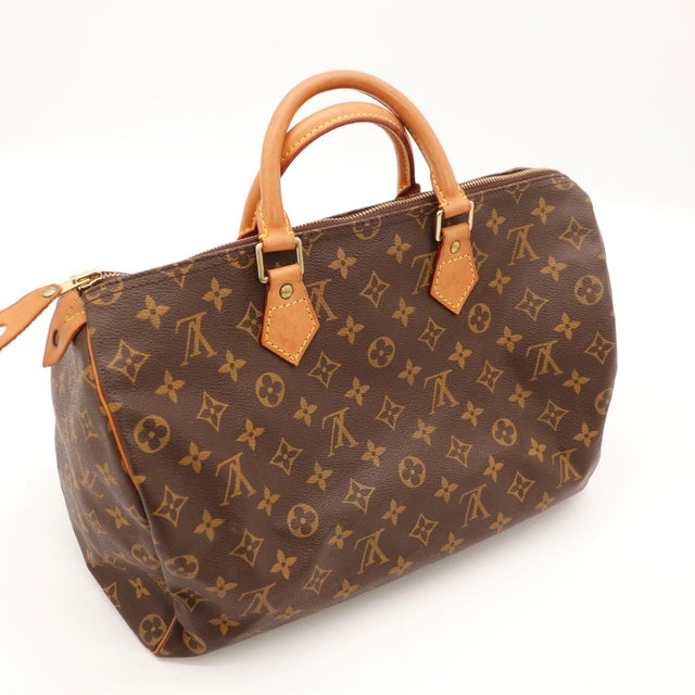 Détail du cadenas et des clés Louis Vuitton Speedy 30 Toile Monogramme occasion authentique — AMANA Vintage