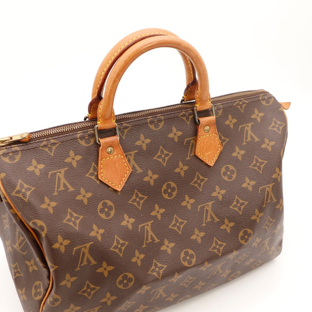 Détail du cadenas Louis Vuitton Speedy 35 Toile Monogramme occasion authentique — AMANA Vintage