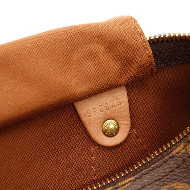 Détail zip et languette cadenas Louis Vuitton Speedy 30 cuir vachette caramel — AMANA Vintage