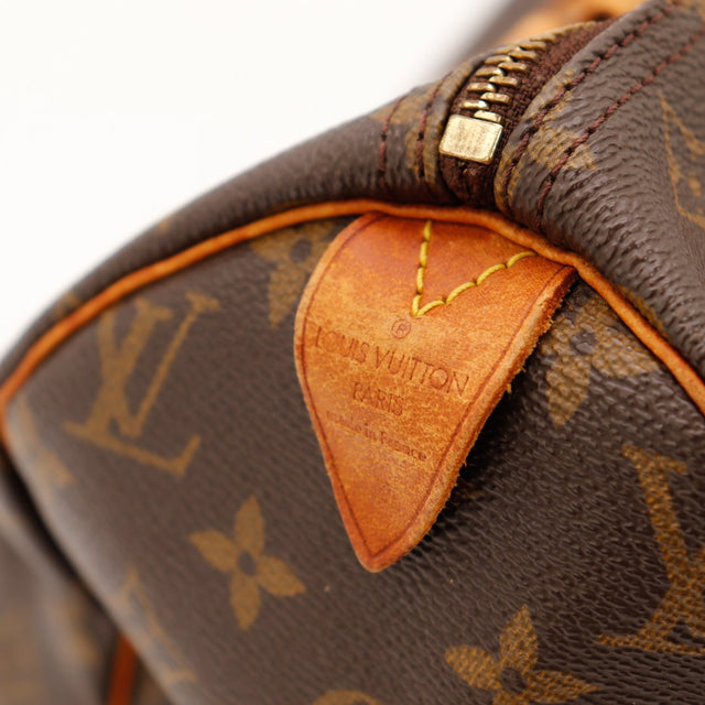 Détail tab cuir vachette Louis Vuitton Speedy 30 made in France — AMANA Vintage
