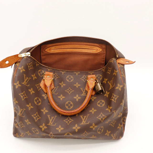 Détail de la tirette Louis Vuitton Speedy 30 Toile Monogramme occasion authentique — AMANA Vintage