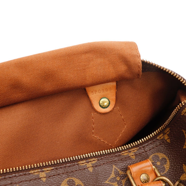 Détail de la fermeture Louis Vuitton Speedy 30 Toile Monogramme occasion authentique — AMANA Vintage