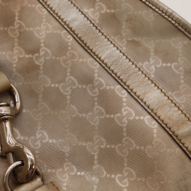 Détail toile monogrammée enduite dorée Gucci Hobo — AMANA Vintage